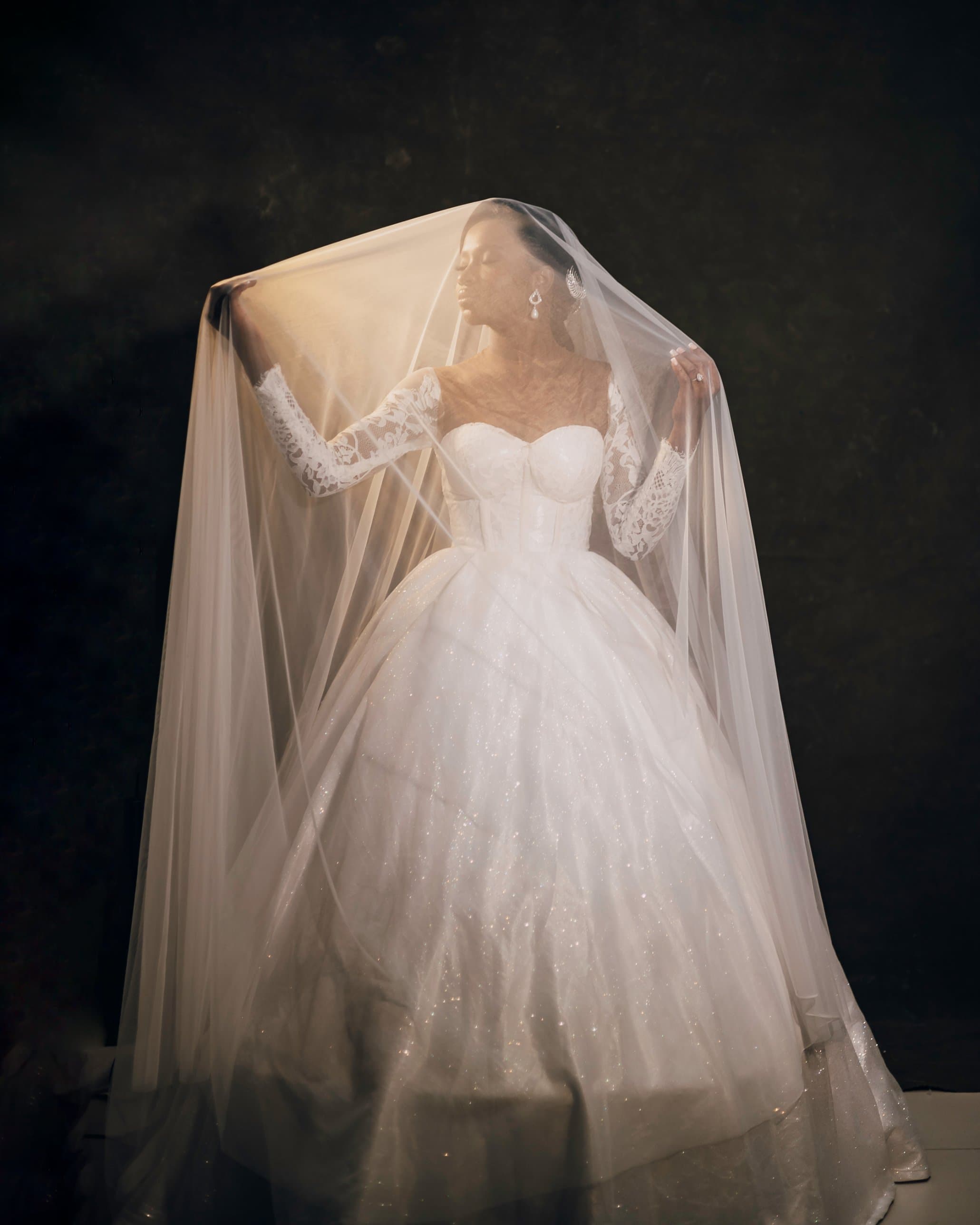 UNIGUISE bespoke bridal gown with lace sleeves and cathedral veil